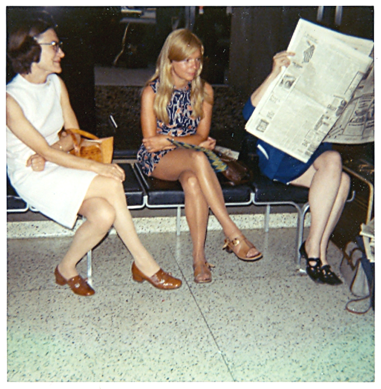 60364 JaneSettlow, PriscillaCooper, - (reading newspaper), LoganAirport, Boston